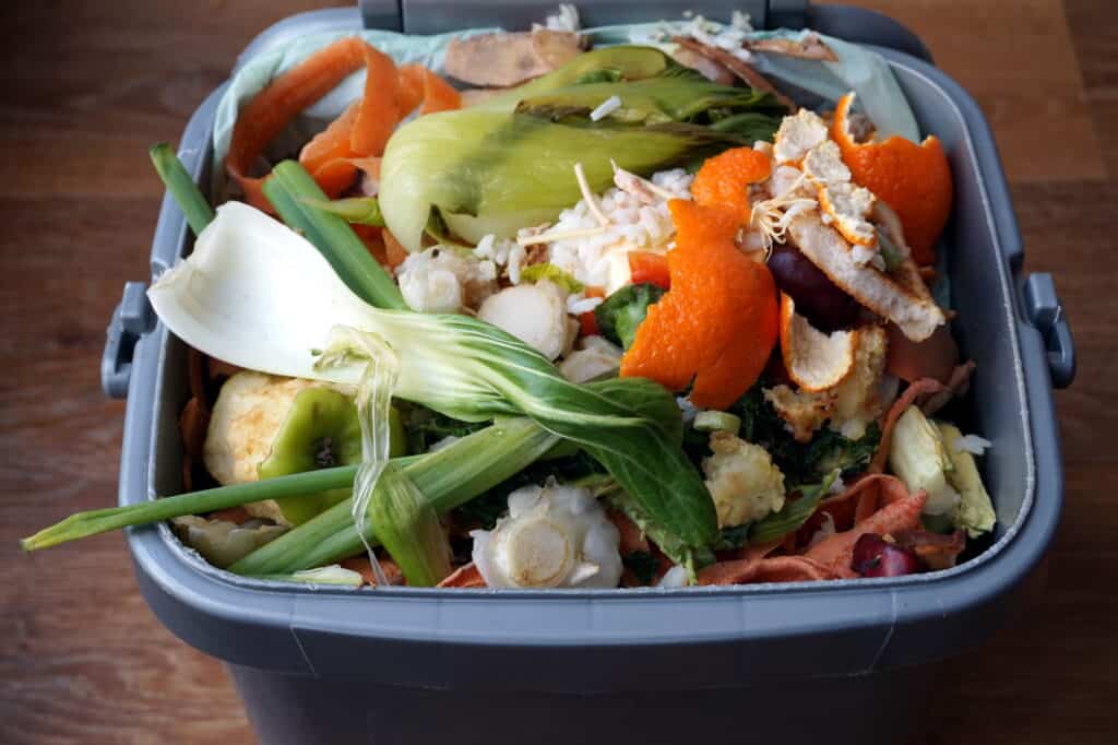 using kitchen scraps helps make compost fast